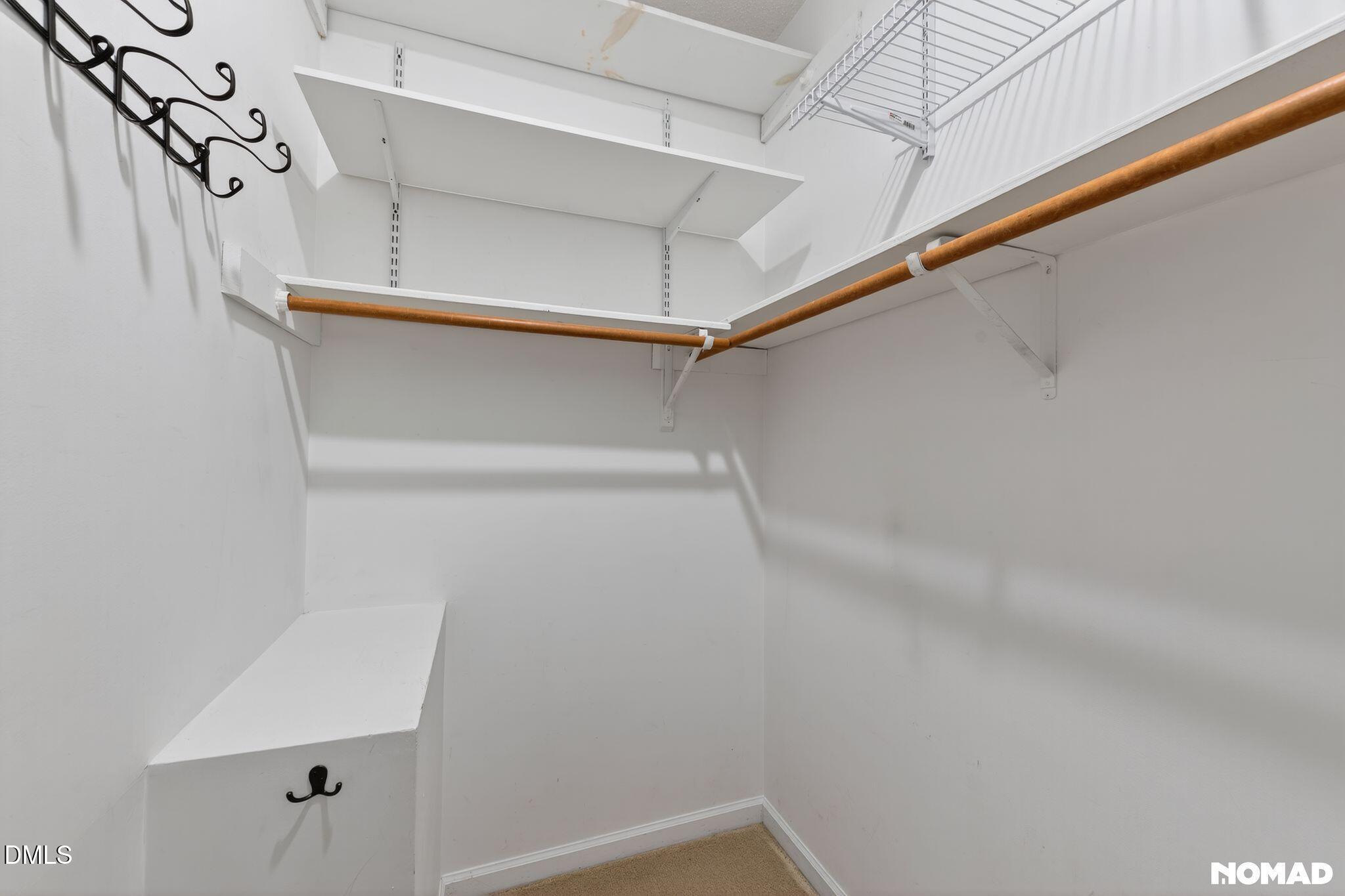 4456 Still Pines Drive Raleigh, NC 27613 - Photo 14 of 16 a view of a room with racks on the wall