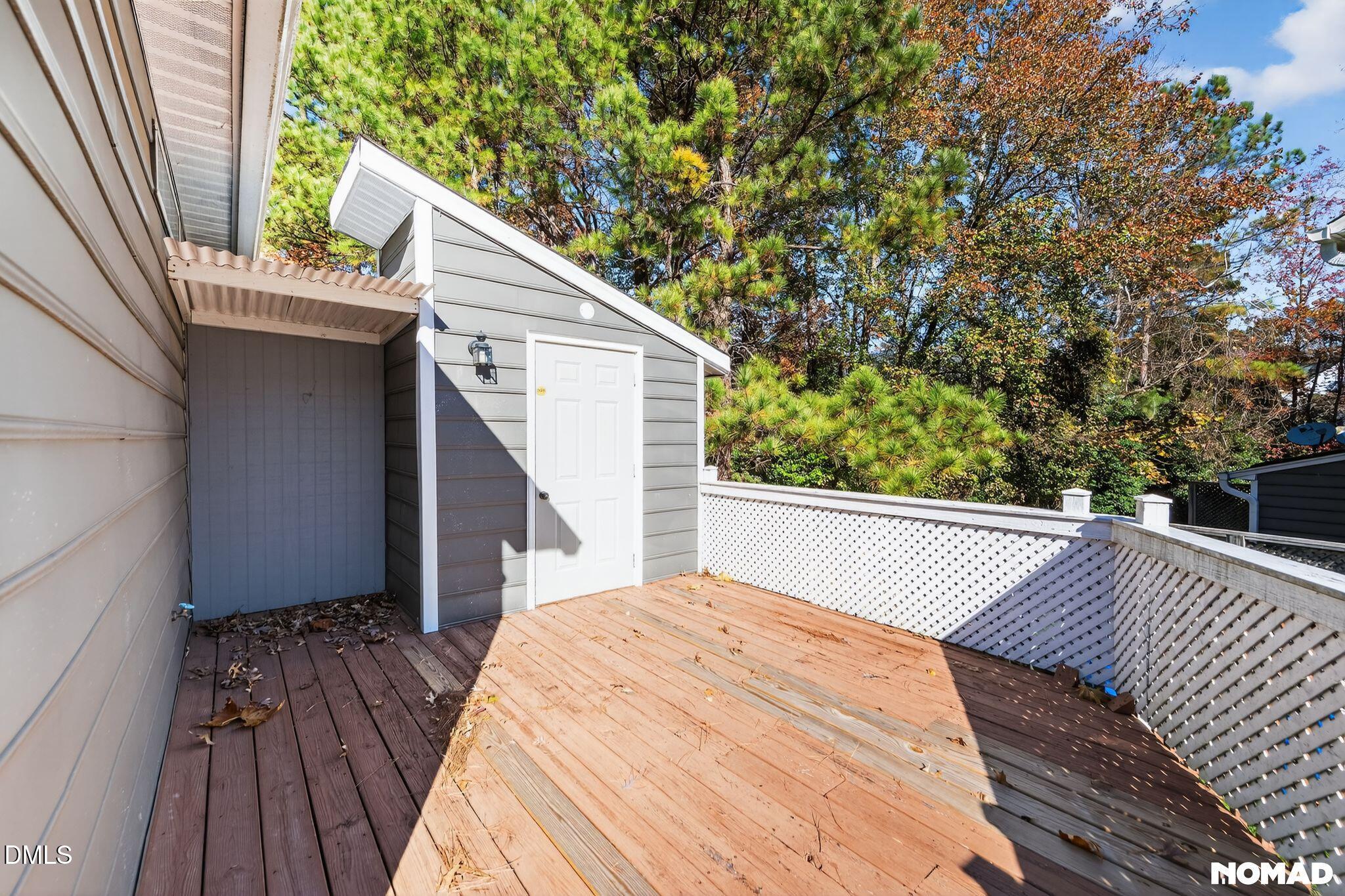 4456 Still Pines Drive Raleigh, NC 27613 - Photo 15 of 16 a view of balcony with wooden floor and fence