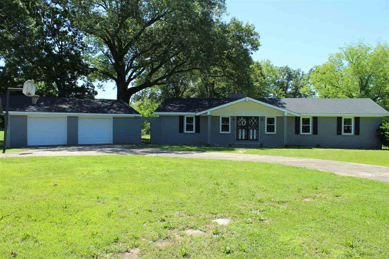 825 Vancleave Road Martin, TN 38237 - Photo 1 of 1 a front view of a house with swimming pool