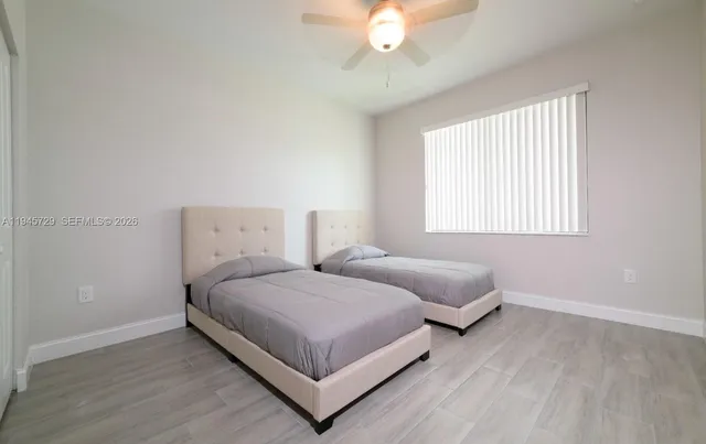 a bathroom with a shower and a glass door