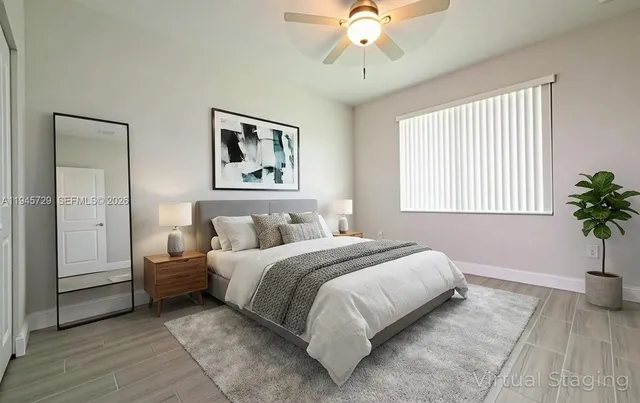 a bedroom with furniture and a window