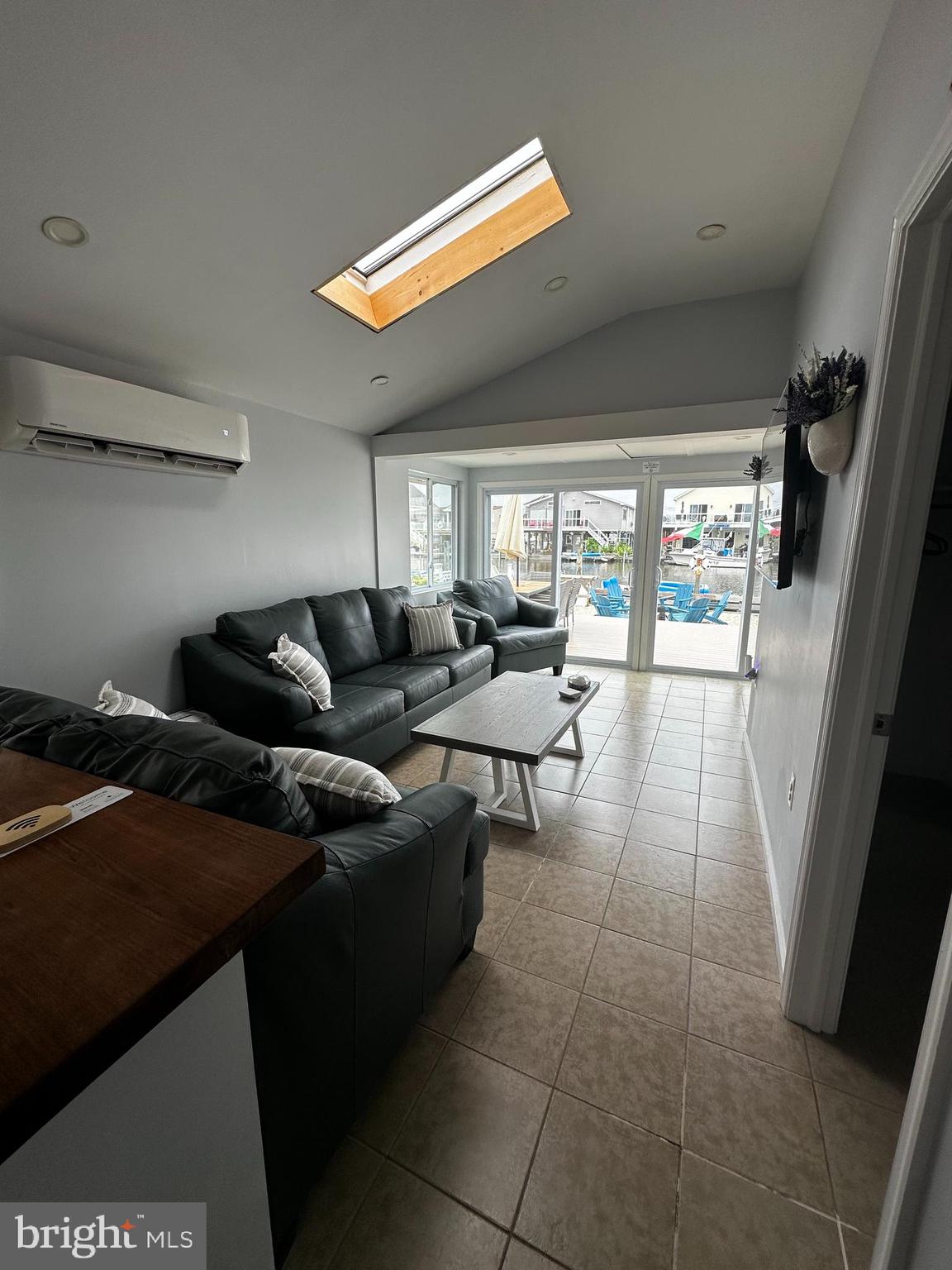 24 Angler Road Tuckerton, NJ 08087 - Photo 15 of 27 a living room with furniture and a floor to ceiling window