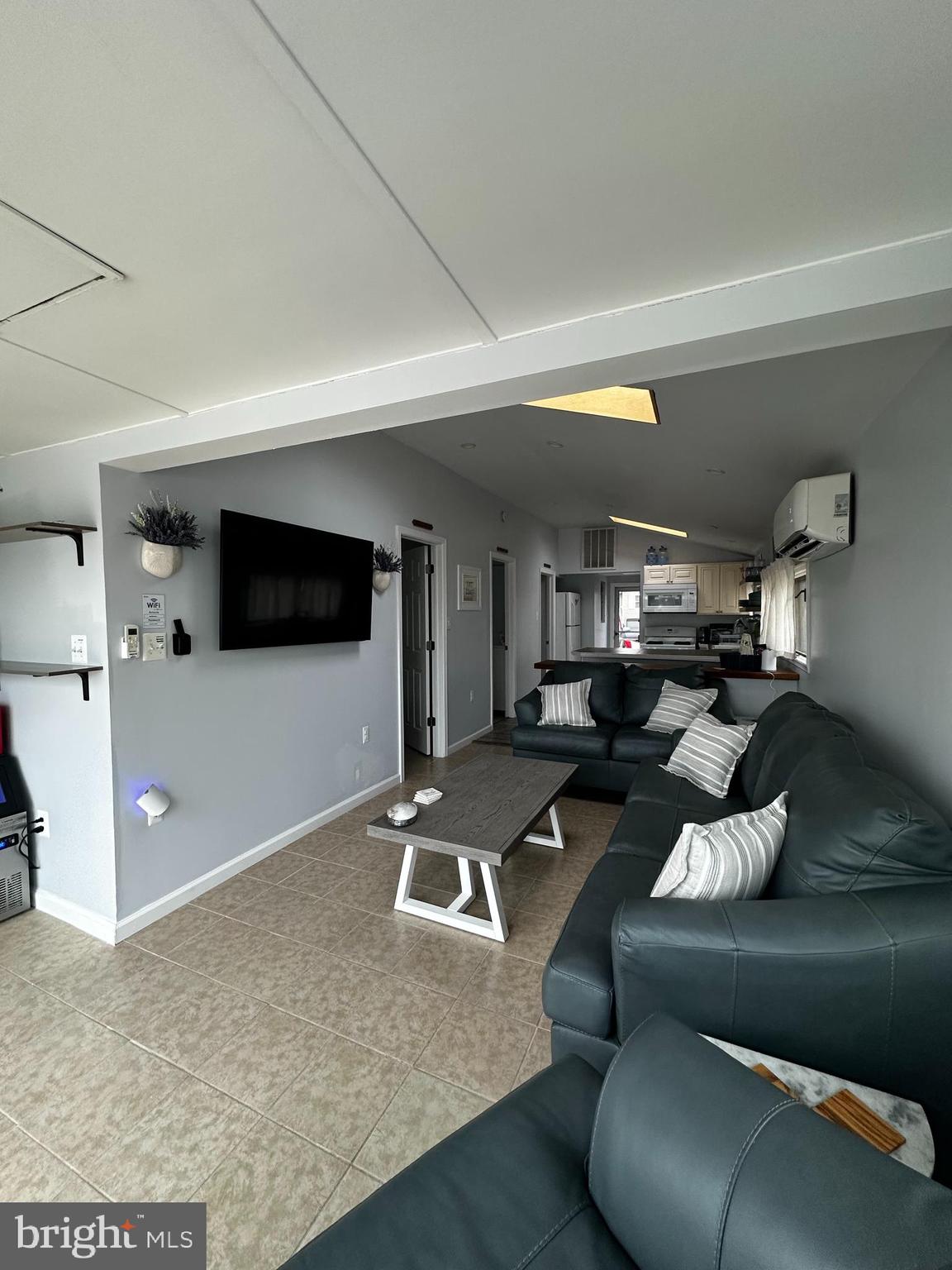 24 Angler Road Tuckerton, NJ 08087 - Photo 16 of 27 a living room with furniture and a flat screen tv