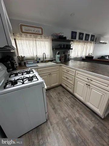 a kitchen with sink cabinets and window