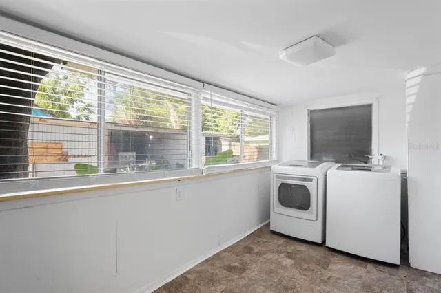 a utility room with dryer and washer
