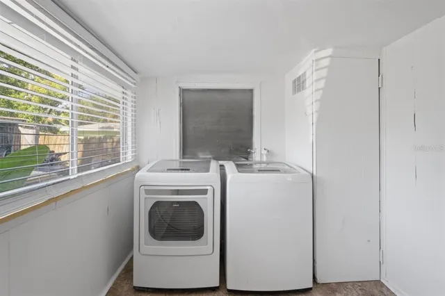 a utility room with dryer and washer