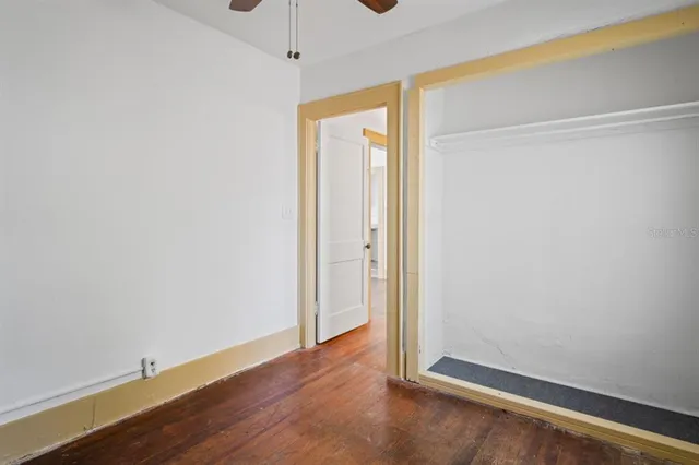 a view of room with wooden floor