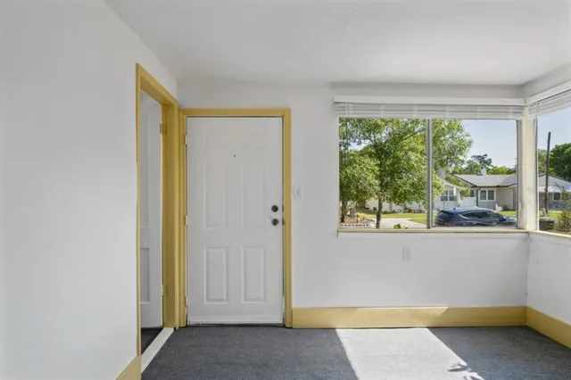 an empty room with windows