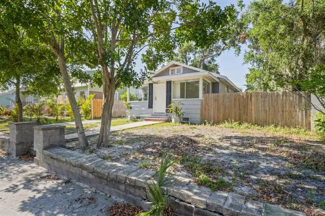a view of a park with plants and a bench