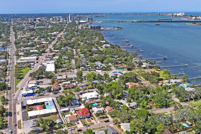 an aerial view of a houses with a yard