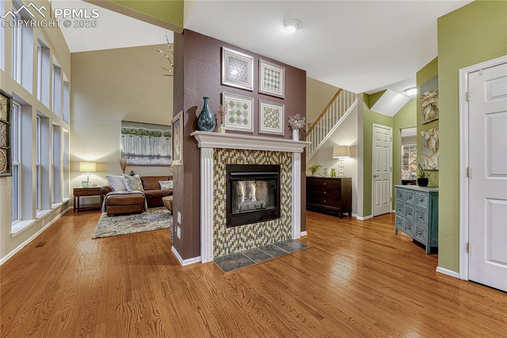 15585 Falcon Ridge Court Colorado Springs, CO 80921 - Photo 6 of 50 a living room with furniture and a fireplace