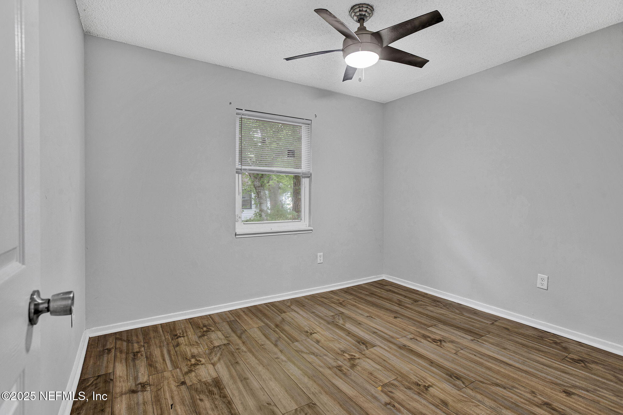 3645 Edison Avenue Jacksonville, FL 32254 - Photo 15 of 19 a view of empty room with wooden floor and fan
