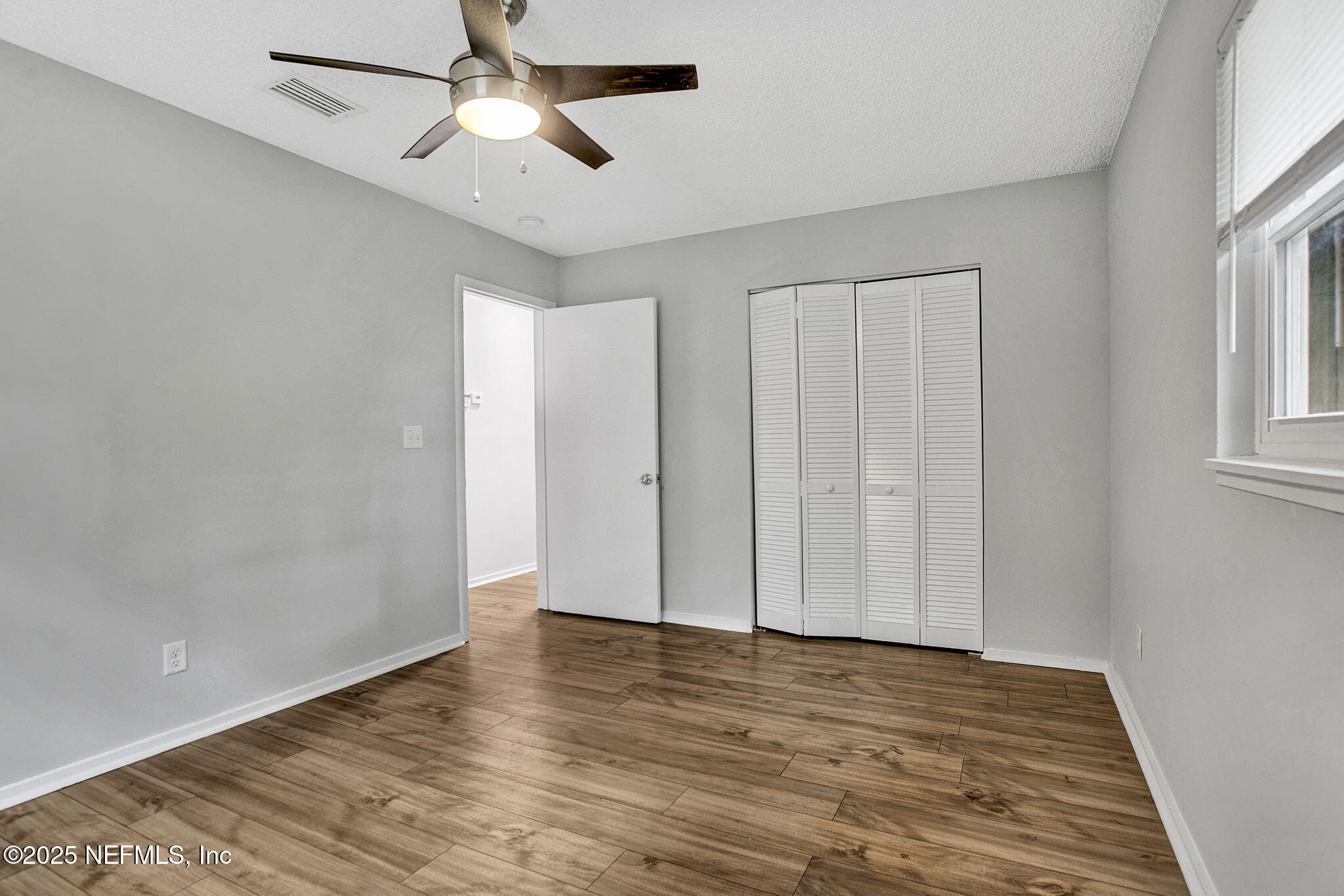 3645 Edison Avenue Jacksonville, FL 32254 - Photo 17 of 19 wooden floor in an empty room with a window
