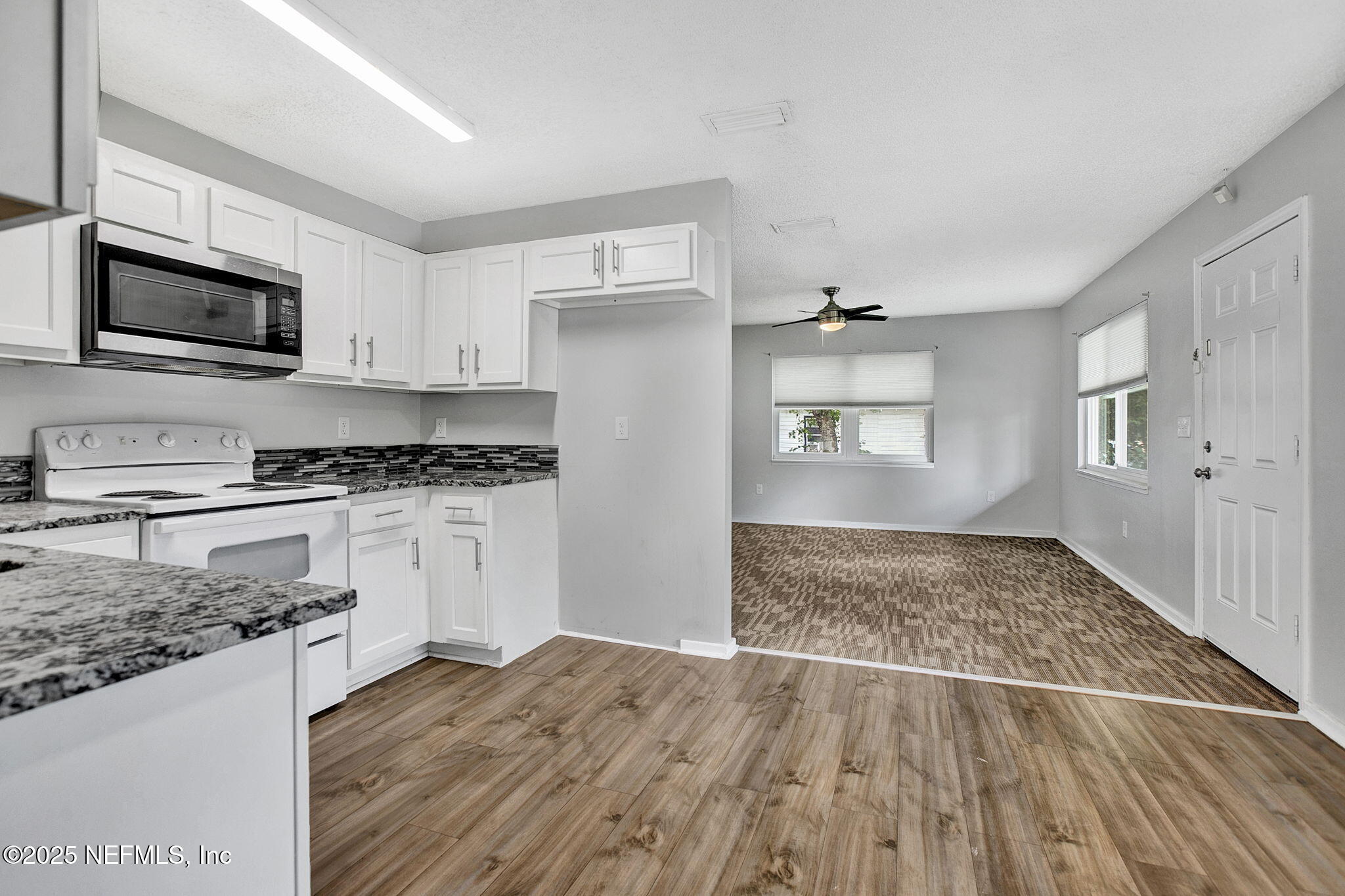 3645 Edison Avenue Jacksonville, FL 32254 - Photo 10 of 19 a kitchen with granite countertop a stove and a sink