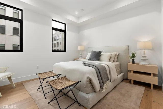 a bedroom with a bed and chair