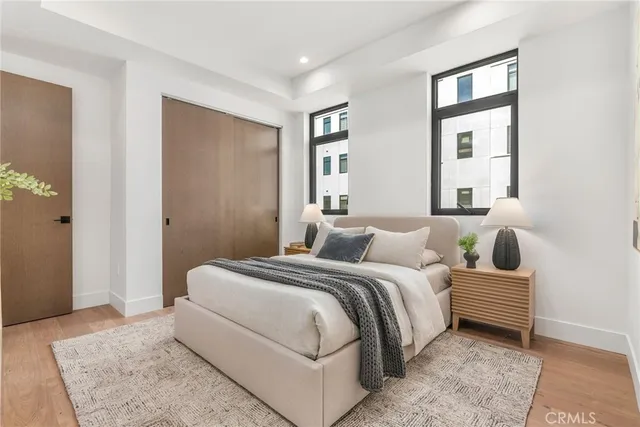 a bedroom with a large bed and a window