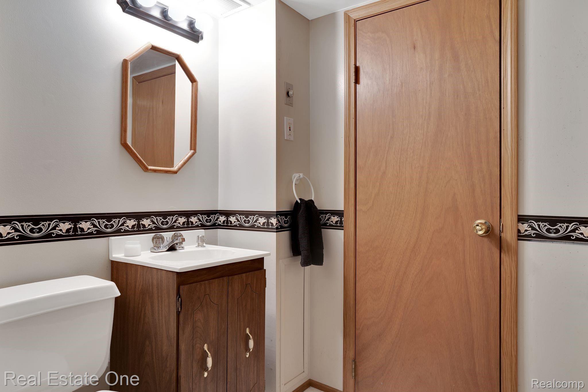 8575 Dale Center Line, MI 48015 - Photo 19 of 23 FULL BETHROOM IN LOWER LEVEL WITH ACCESS TO STORAGE ROOM