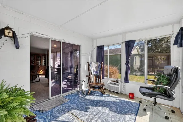 a view of a livingroom with furniture and windows