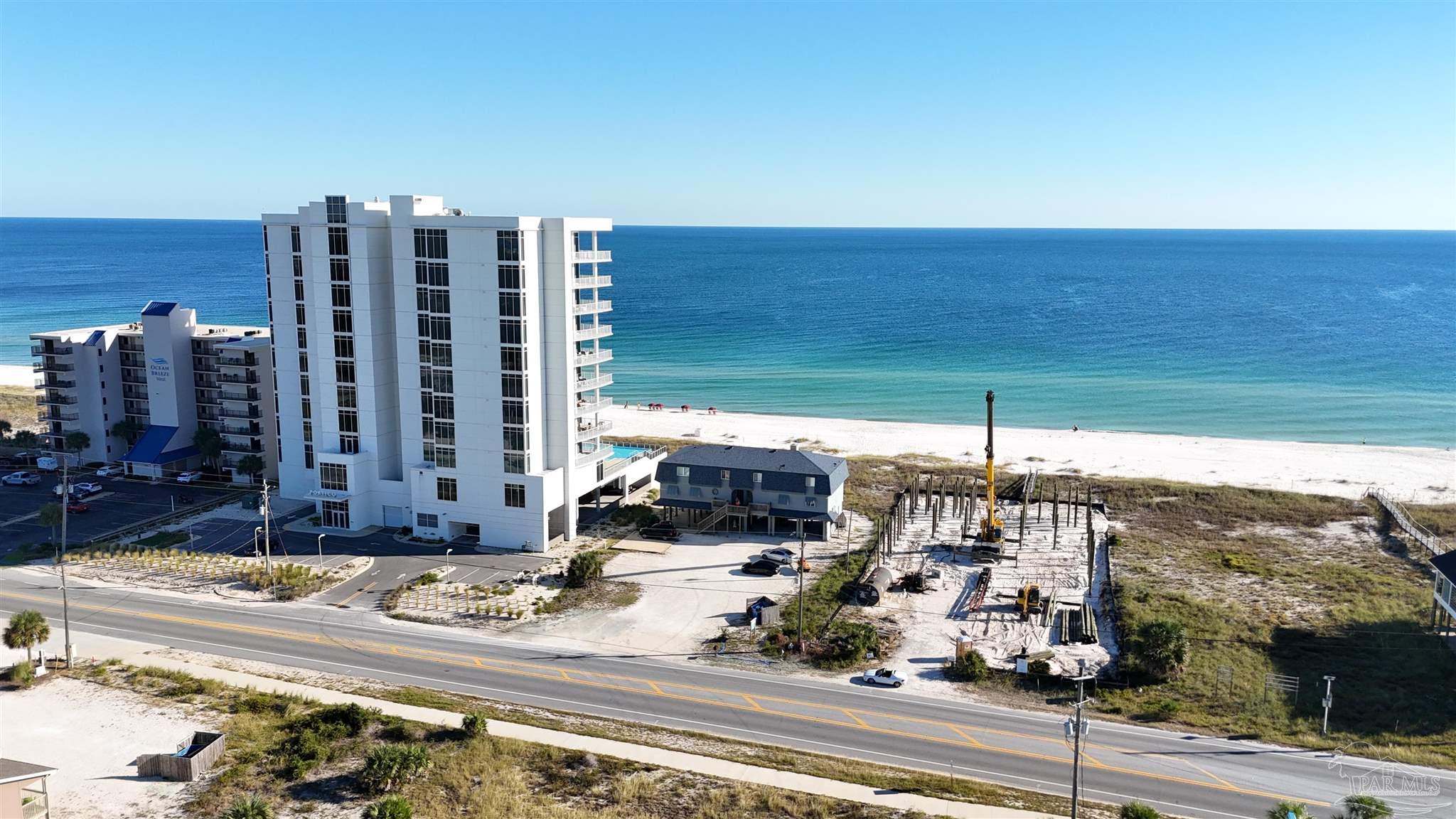 14719 Perdido Key Drive Perdido Key, FL 32507 - Photo 7 of 21 a view of a building with a yard