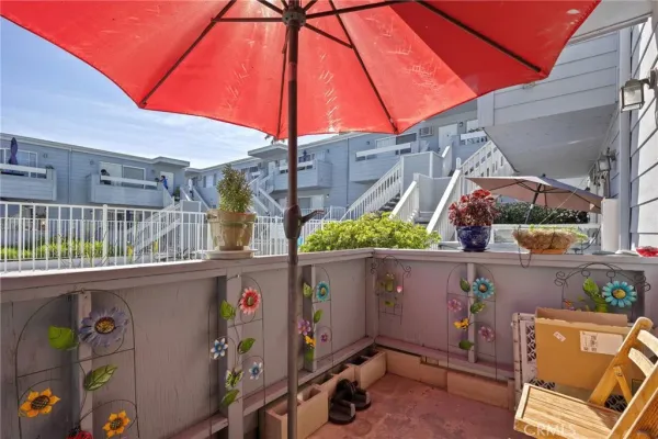 a view of a house with swimming pool and sitting area