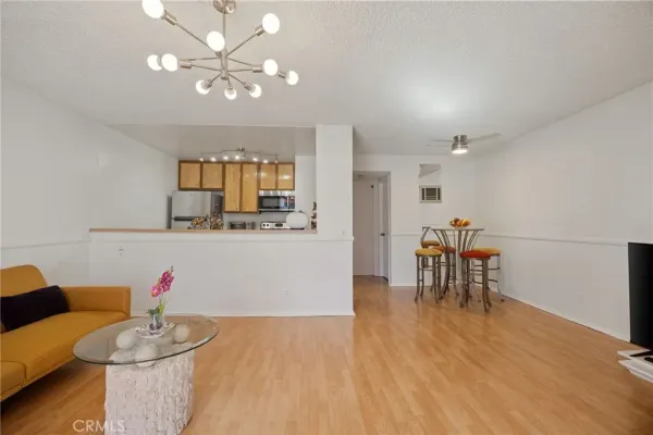 a view of a livingroom with furniture and wooden floor
