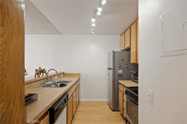 a kitchen with stainless steel appliances granite countertop a stove and a microwave