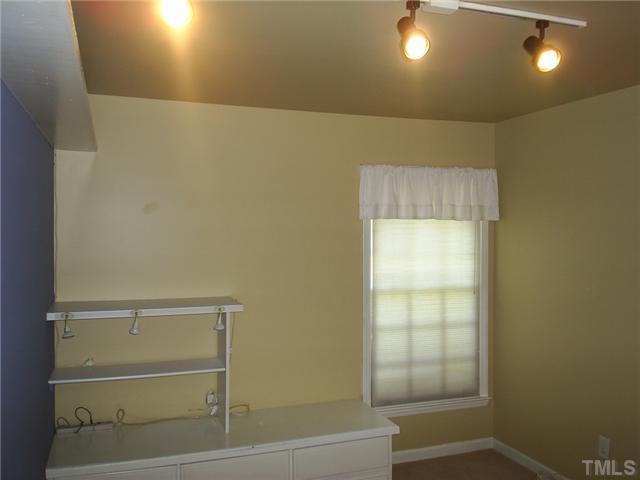 6909 Whittlesea Place Raleigh, NC 27616 - Photo 12 of 16 I know I just mentioned that the dining room can be converted, but that's if someone is going to claim this bedroom as an office. Which is how it was used. These Built in Bookshelves work great alone for a bedroom or for added storage!
