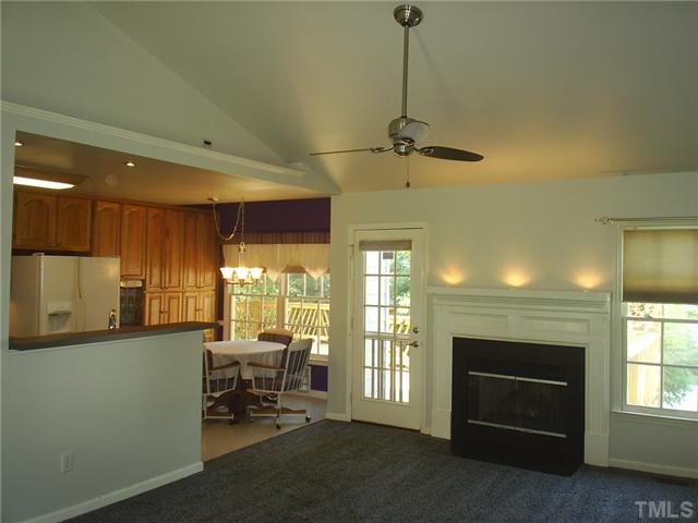 6909 Whittlesea Place Raleigh, NC 27616 - Photo 6 of 16 Speaking of the fireplace view... The cathedral ceiling and fan make it no worries everyday that you are chilly or warm. With built in surround sound you can set up the living area to double as your theatre room!