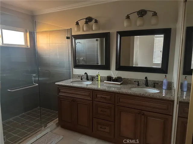 a bathroom with a granite countertop sink a mirror and a