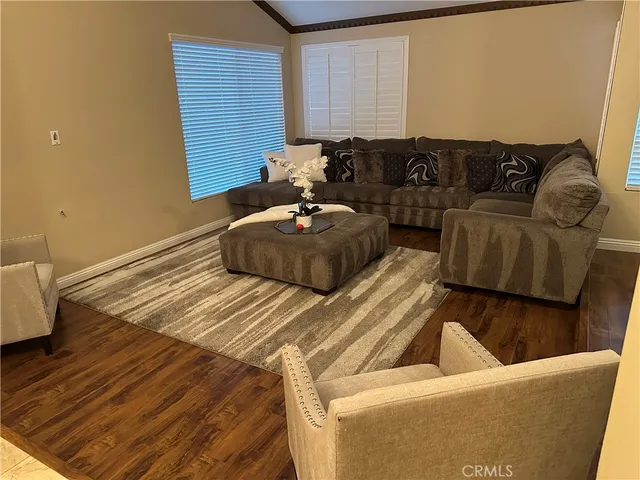 a living room with a couch and a rug