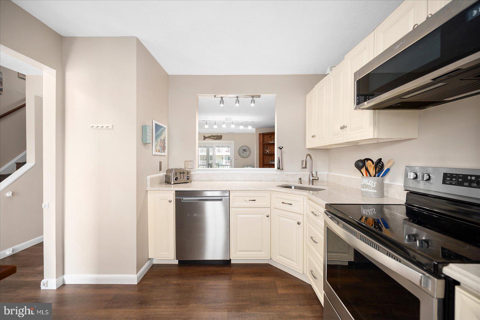 608 Osprey Road, Unit 2 Ocean City, MD 21842 - Photo 8 of 47 Gourmet Kitchen w/Cut out to the Dining Room