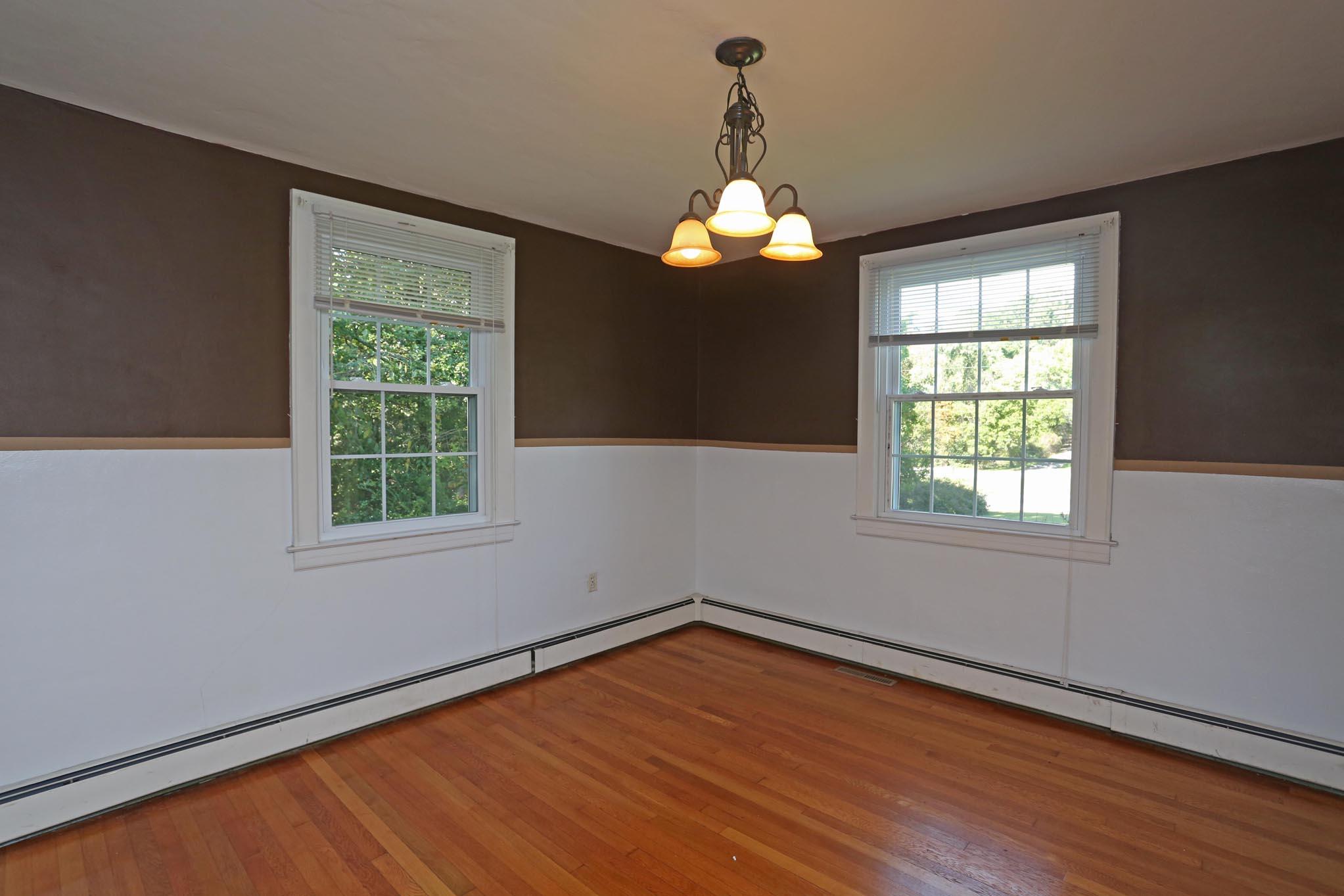 3124 Blue Ridge Boulevard Roanoke, VA 24012 - Photo 8 of 49 en empty room with wooden floor and windows