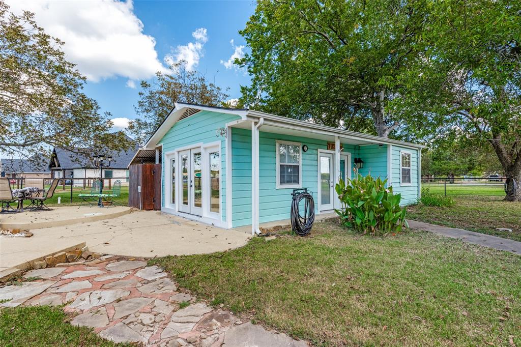 9591 Dripping Spring Road Denison, TX 75021 - Photo 15 of 23 a view of a house with a garden