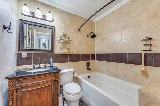 a bathroom with a sink a toilet and a bathtub