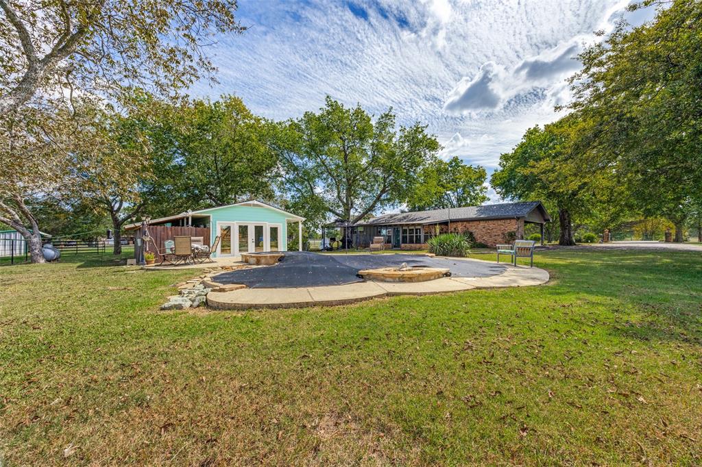 9591 Dripping Spring Road Denison, TX 75021 - Photo 3 of 23 a view of house with outdoor space and swimming pool