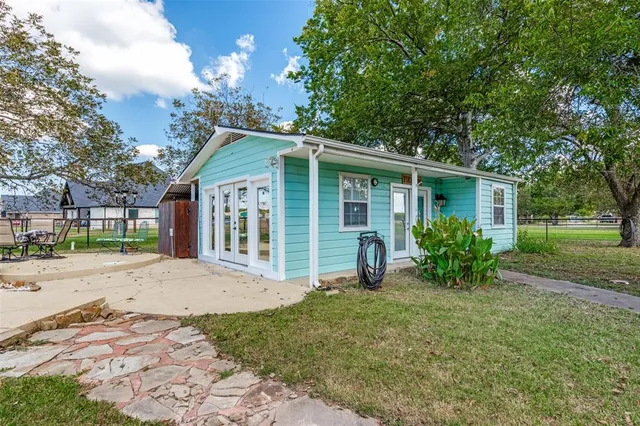 a view of a house with a garden
