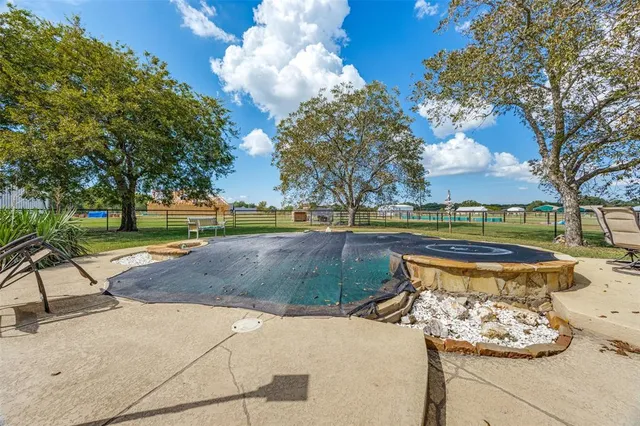 a view of a park with large trees