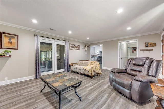 a spacious bedroom with a bed window and couch