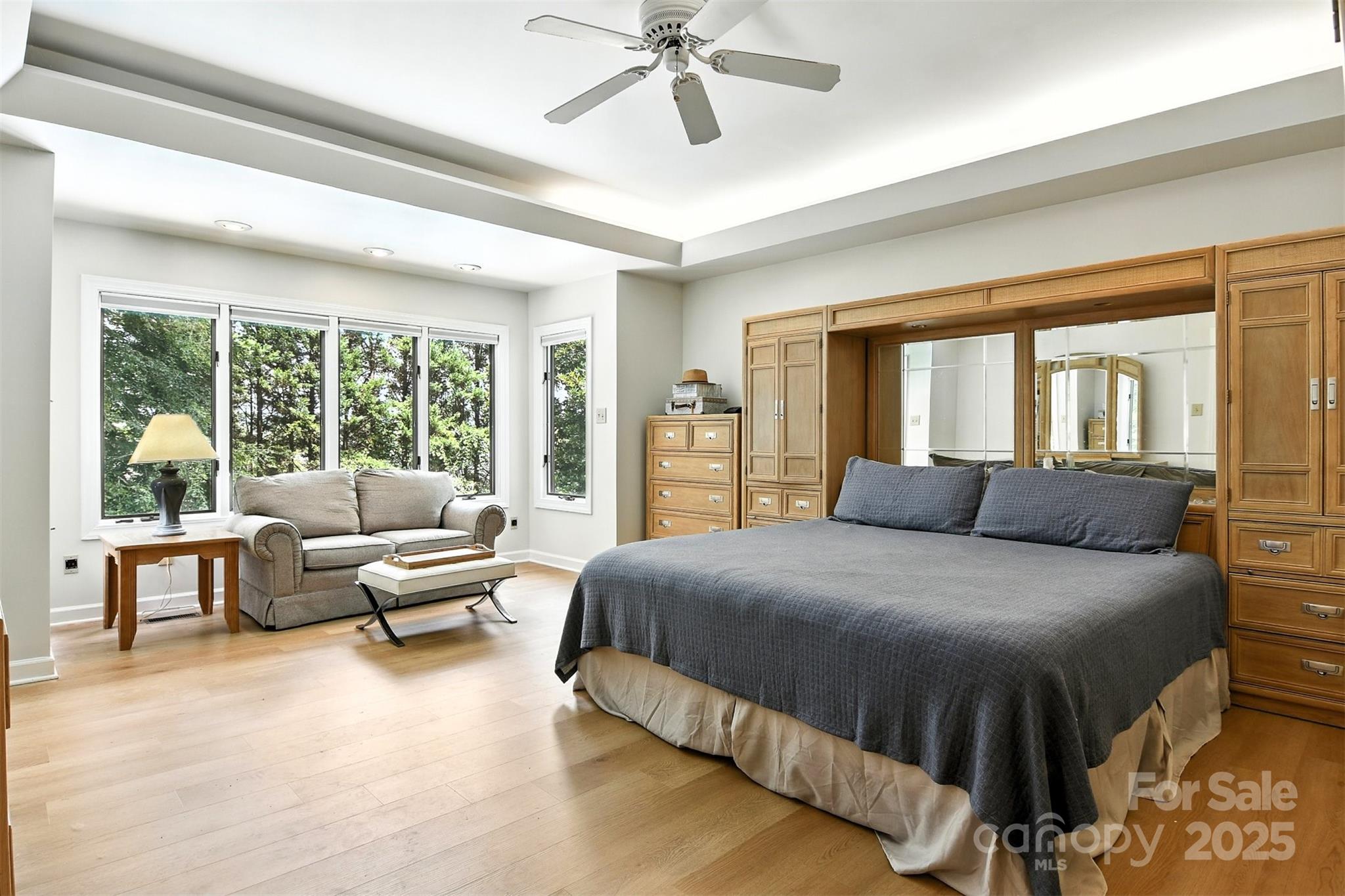 5042 Ridge Land Drive Hickory, NC 28602 - Photo 16 of 46 a bedroom with a bed and glass walk in closet