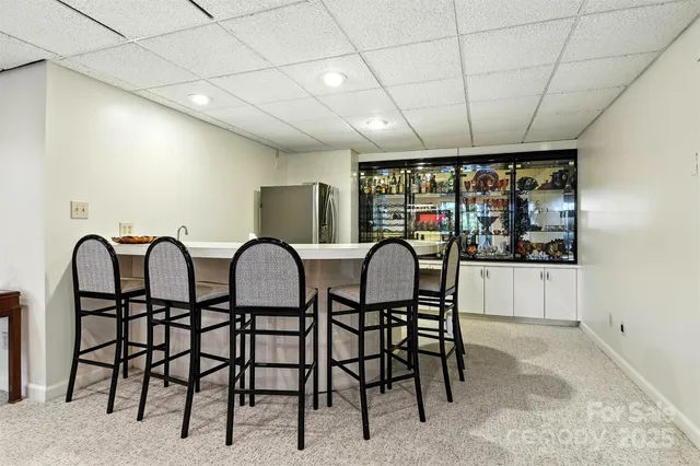 a view of a chairs and tables in a room