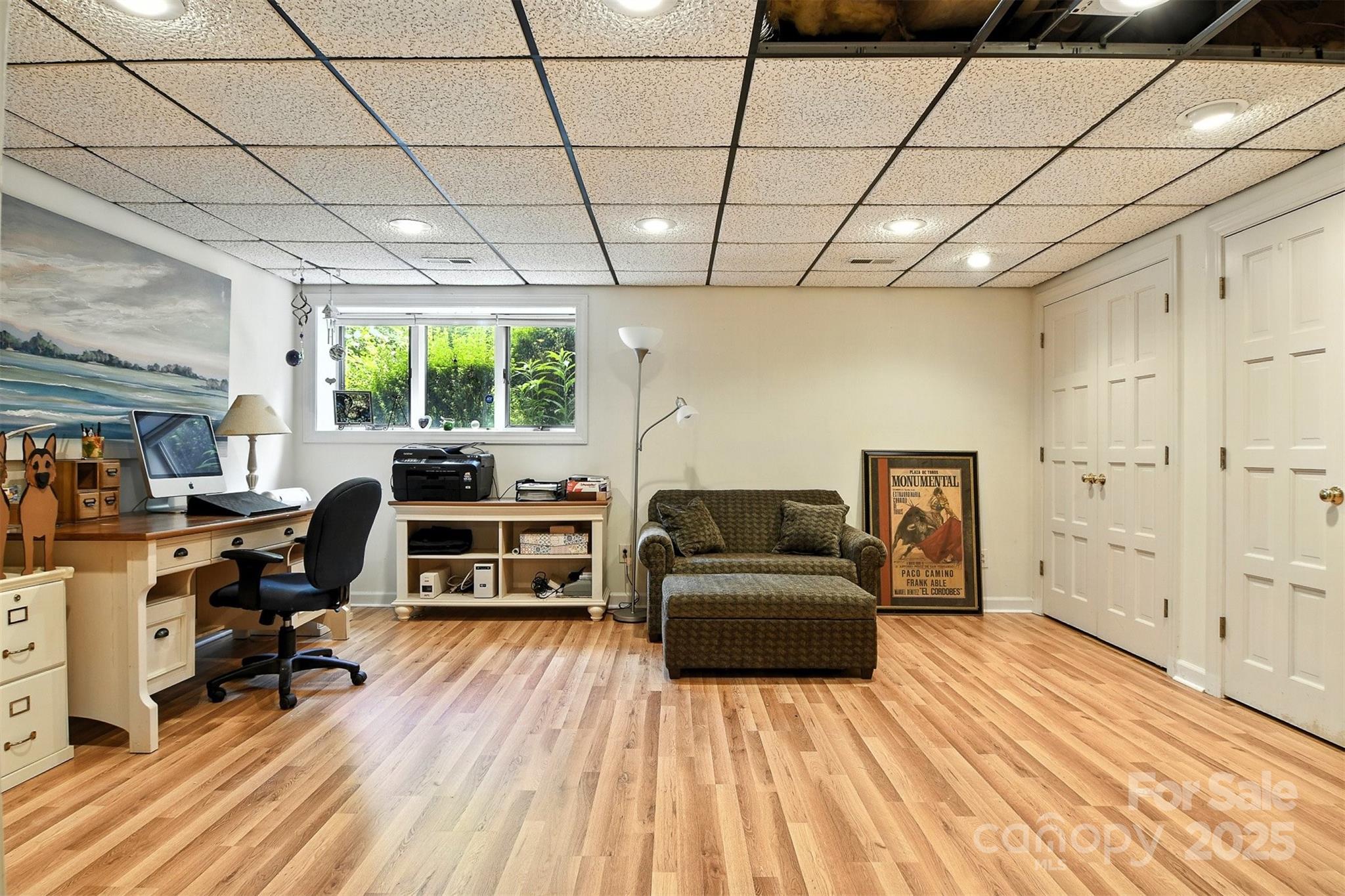 5042 Ridge Land Drive Hickory, NC 28602 - Photo 33 of 46 a living room with furniture a flat screen tv and a floor to ceiling window