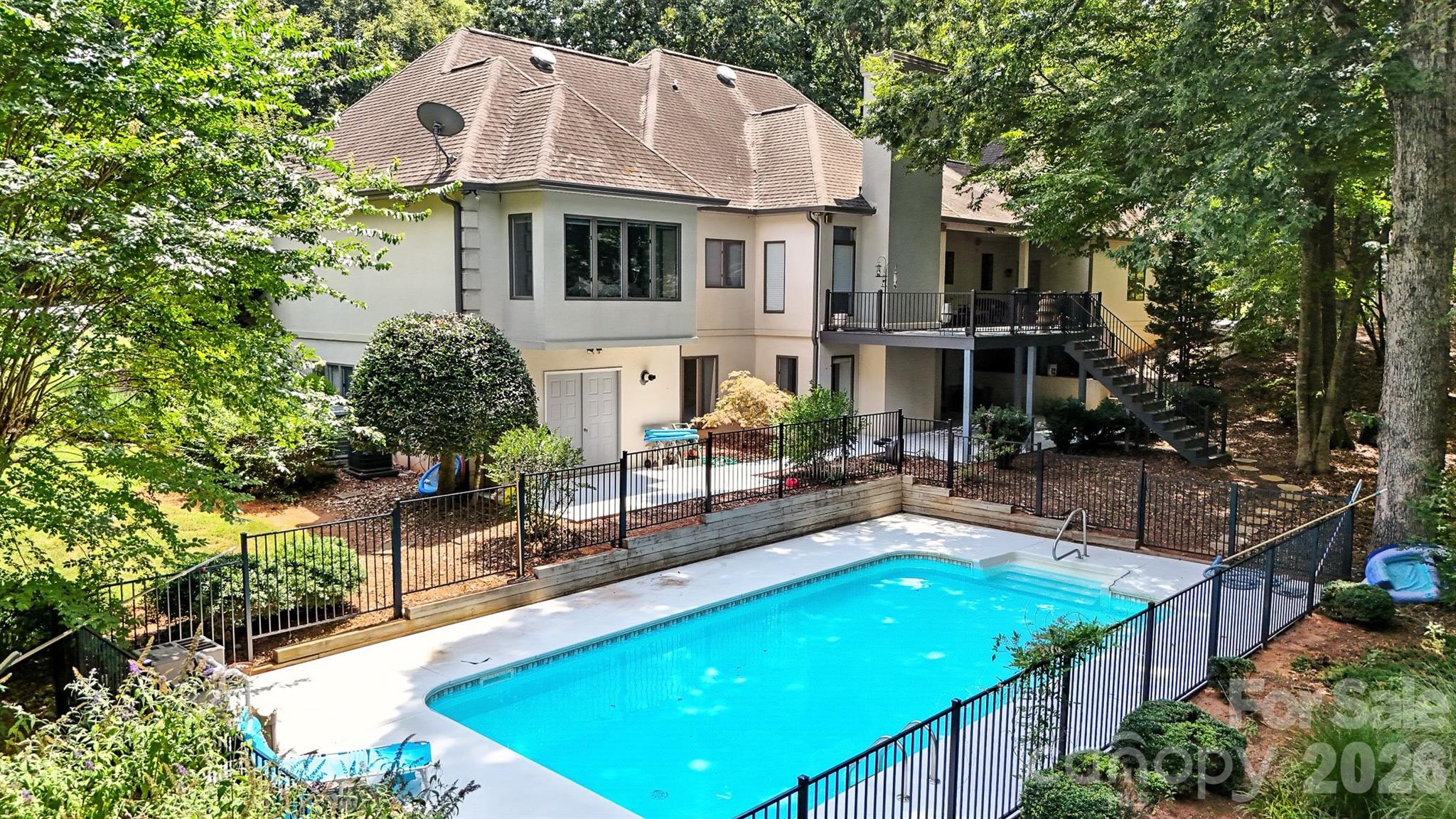 5042 Ridge Land Drive Hickory, NC 28602 - Photo 42 of 46 a view of a house with pool and chairs