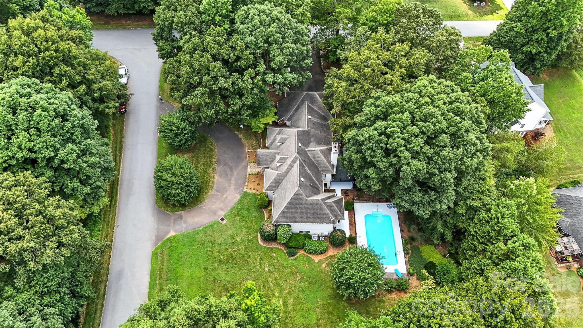 5042 Ridge Land Drive Hickory, NC 28602 - Photo 44 of 46 an aerial view of a house with swimming pool and garden space