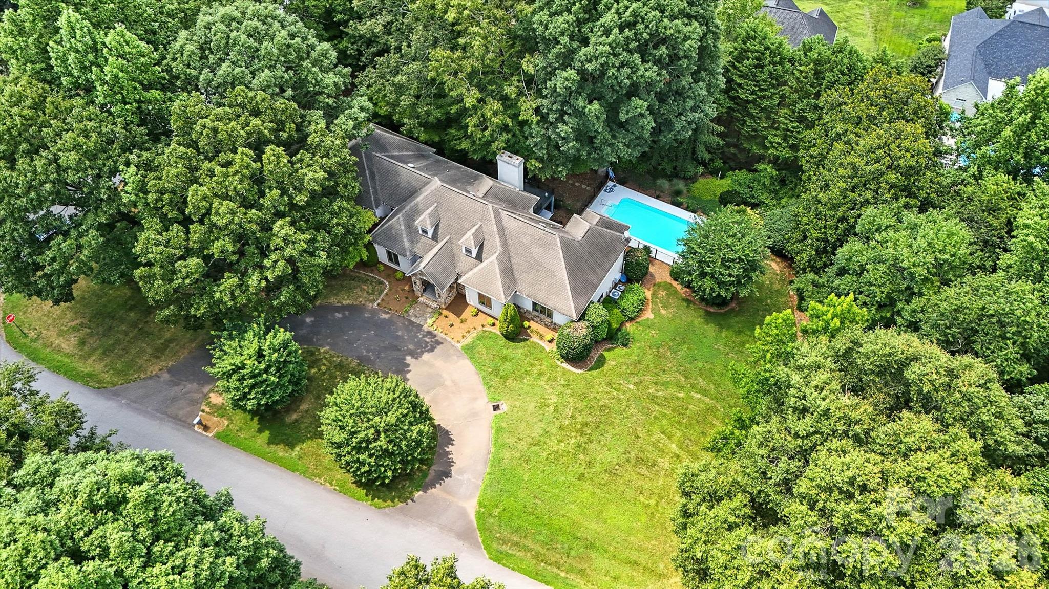 5042 Ridge Land Drive Hickory, NC 28602 - Photo 45 of 46 an aerial view of a house with a yard and trees
