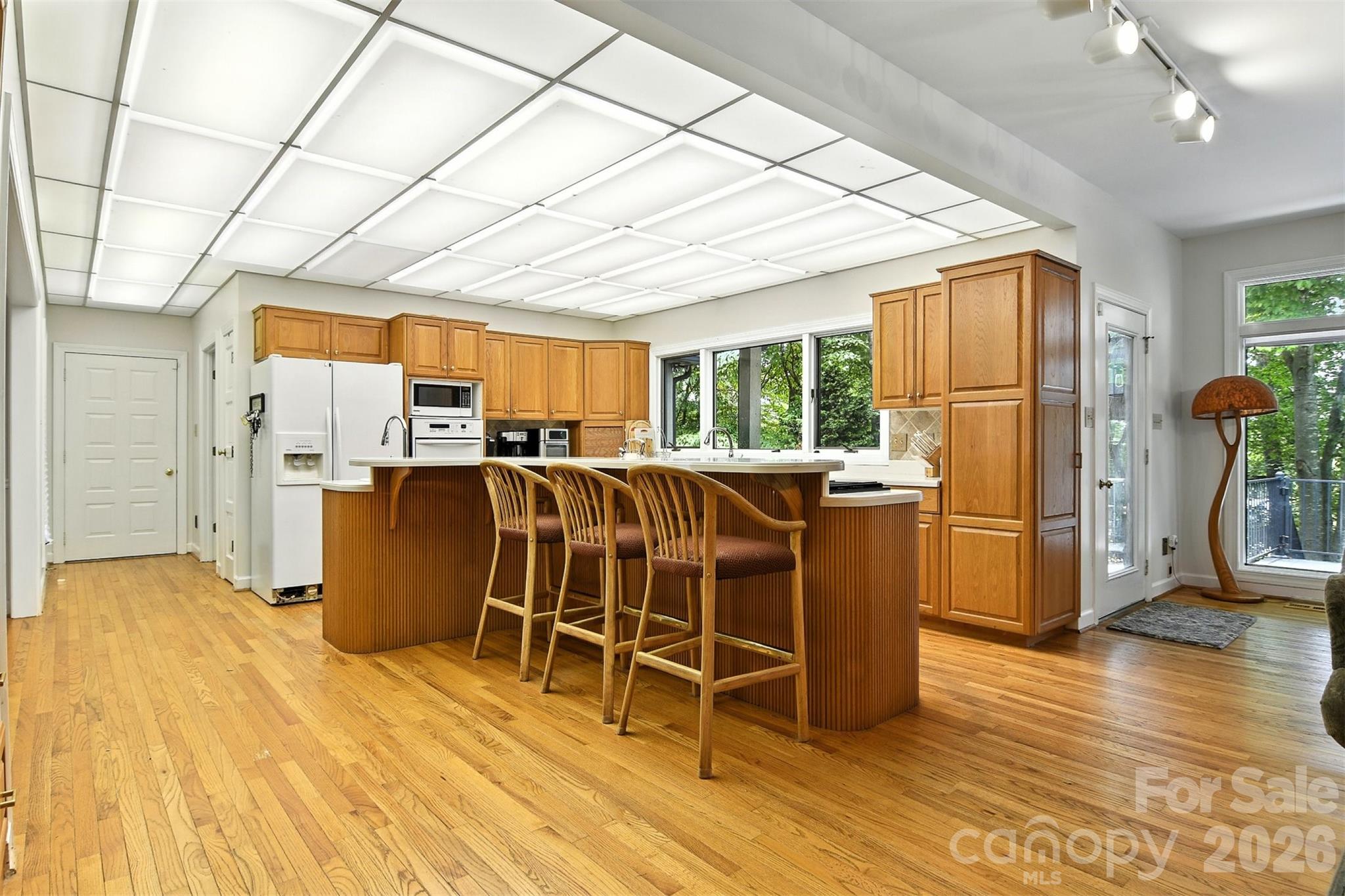 5042 Ridge Land Drive Hickory, NC 28602 - Photo 9 of 46 a view of a dining room with furniture window and wooden floor