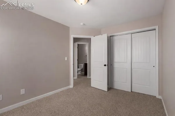 a view of a livingroom with a ceiling fan
