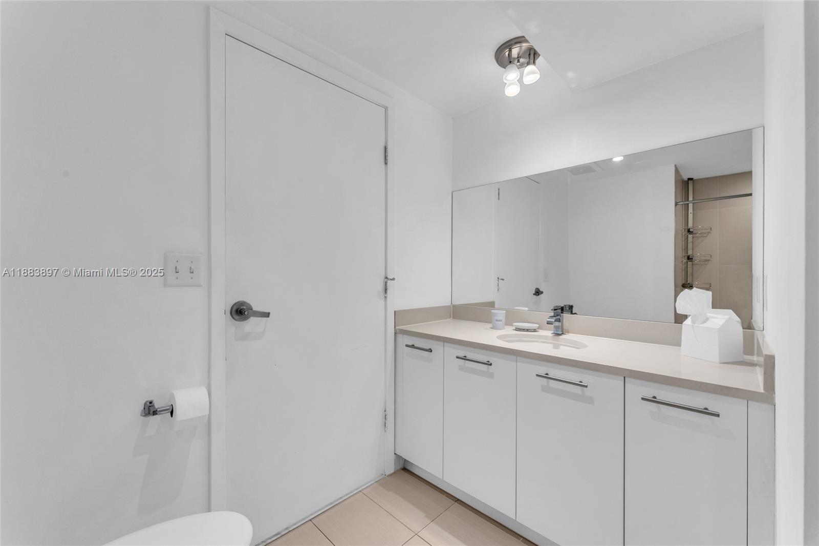 3250 Northeast 1st Avenue, Unit 1120 Miami, FL 33137 - Photo 17 of 39 a bathroom with a granite countertop sink toilet and shower