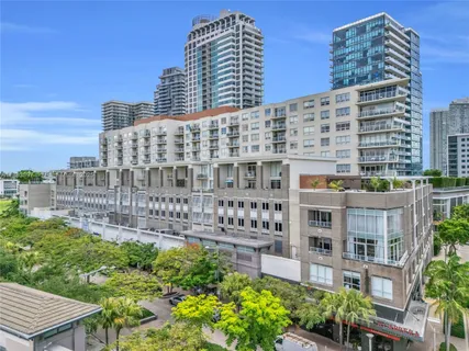 a large building with a bench in front of it