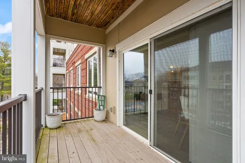 a view of a balcony with wooden floor