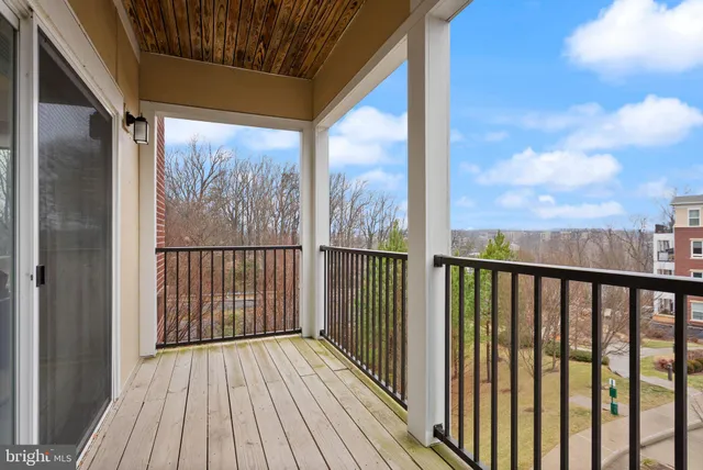 a view of a balcony with wooden floor